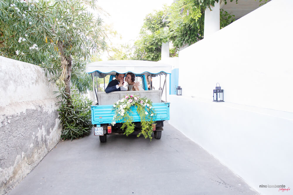 Stromboli, the bride and groom greet the Piaggio Ape car embellished for the wedding