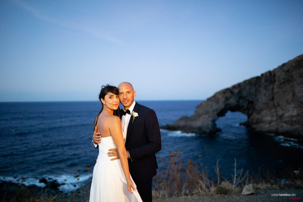 Bride and Groom in front of the famous arch of the elephant in the black pearl of the Mediterranean